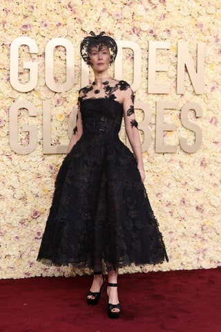 Image may contain Rosamund Pike Fashion Clothing Footwear High Heel Shoe Person Adult Wedding and Dress